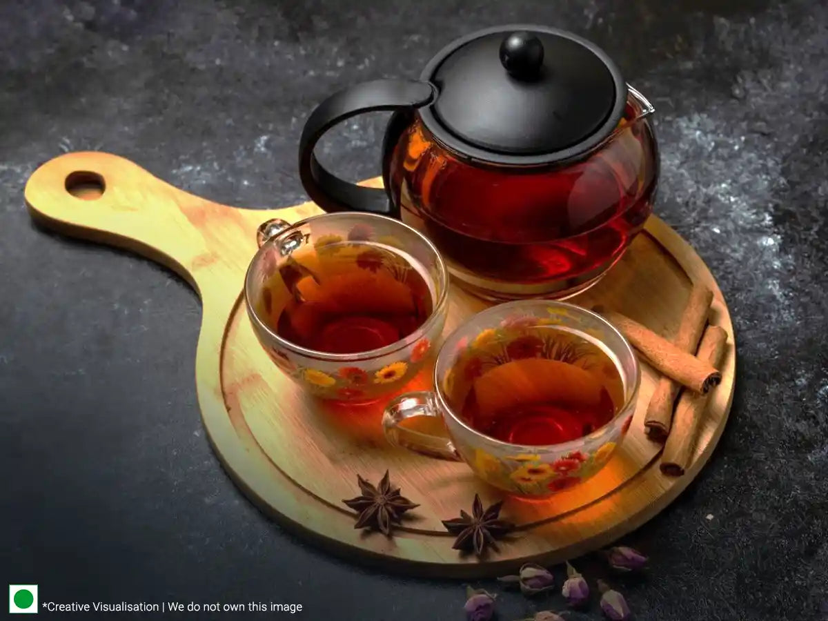 Tea with spices on a wooden tray - a delightful blend of black tea infused with aromatic spices.